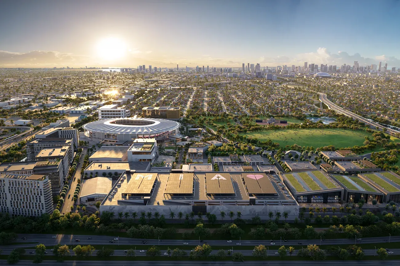 Aerial view of Miami Freedom Park at sunset, the stadium and retail village set against the Miami skyline